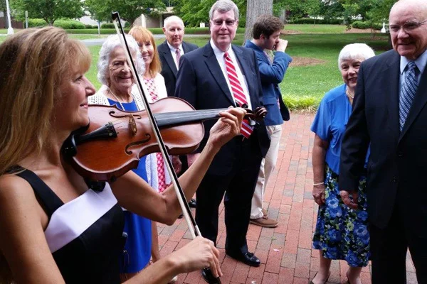 Playing violin for crowd